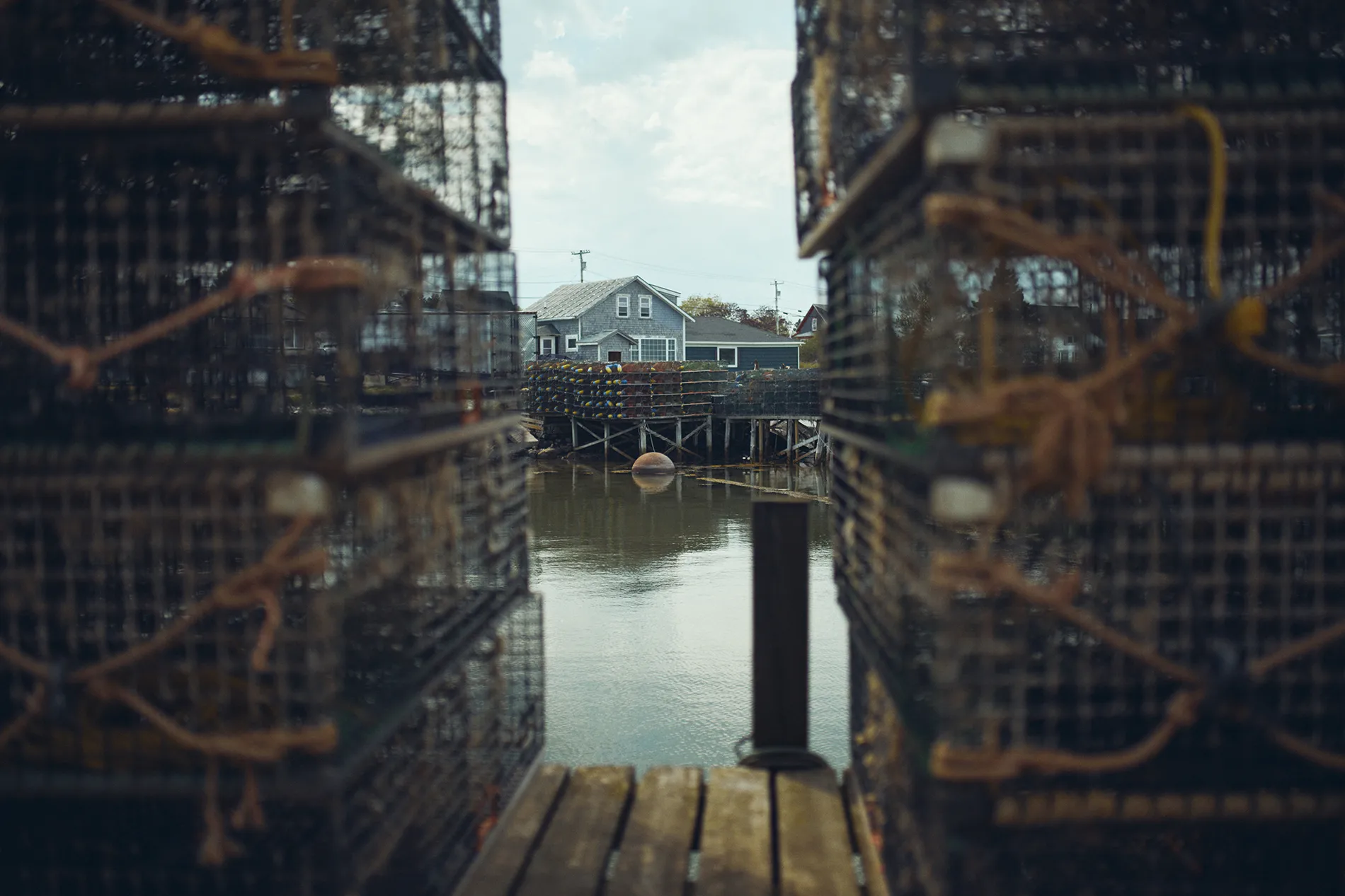 looking through lobster traps at a wharf